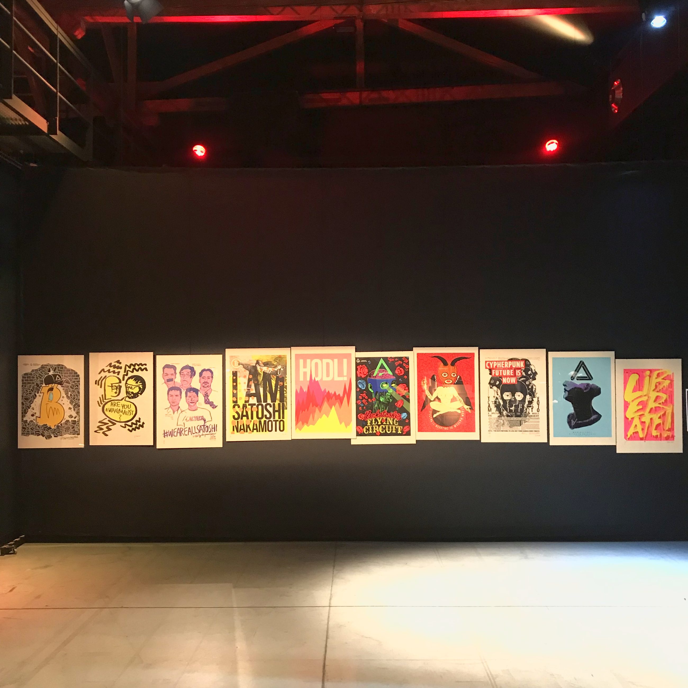 Exhibition at Hackers Congress Paralelní Polis — under red stage lighting